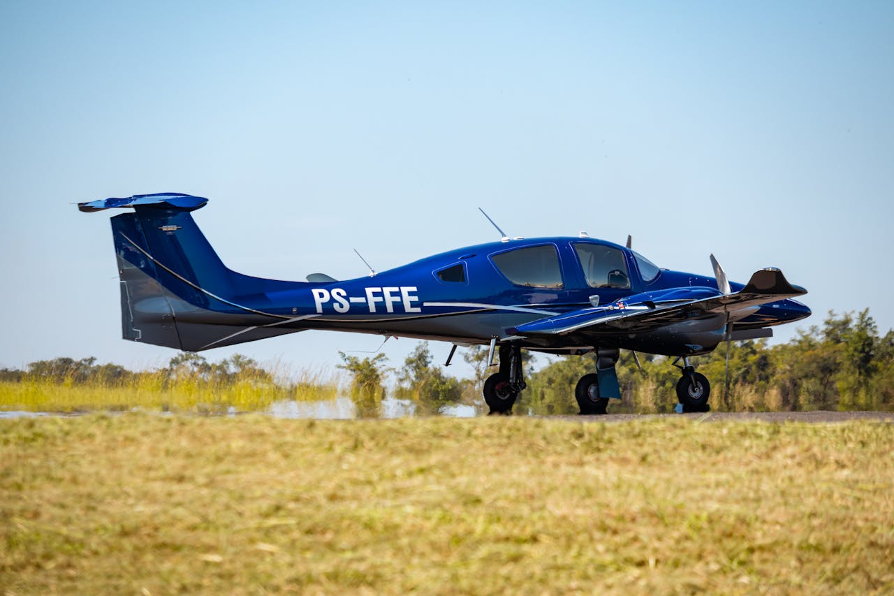 contact-img Blue Diamond DA-62 airplane on grassy field in Araraquara, Brazil, scenic day view.